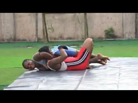 The game of strength. Will she ever escape the guillotine and leg lock? 