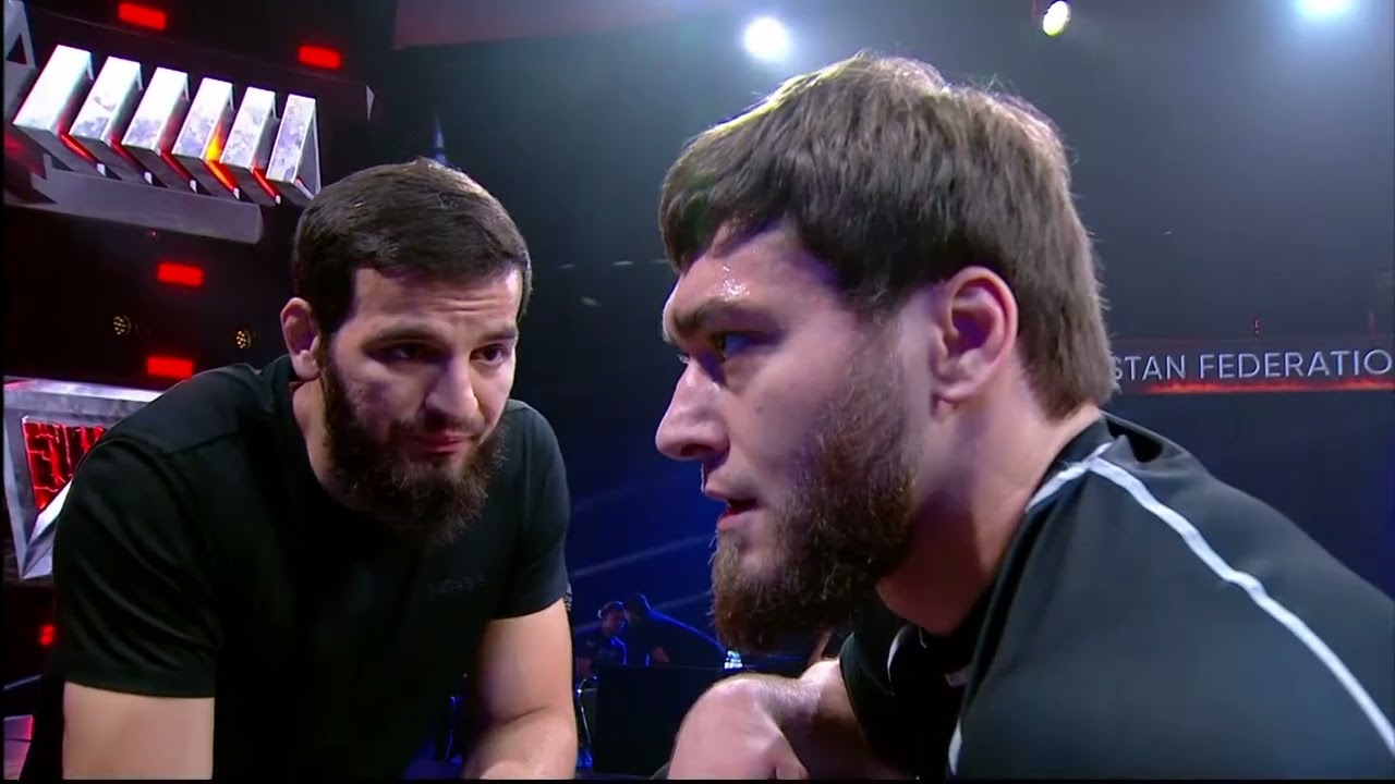76 kg Omar Mannarov vs Kade Anastasios background