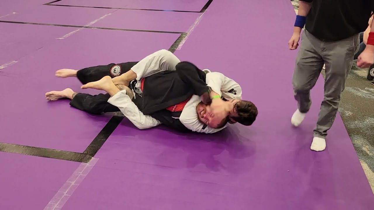 Rear Naked Choke (RNC) win in White Belt BJJ match Holy City Sub Series March 2023 background
