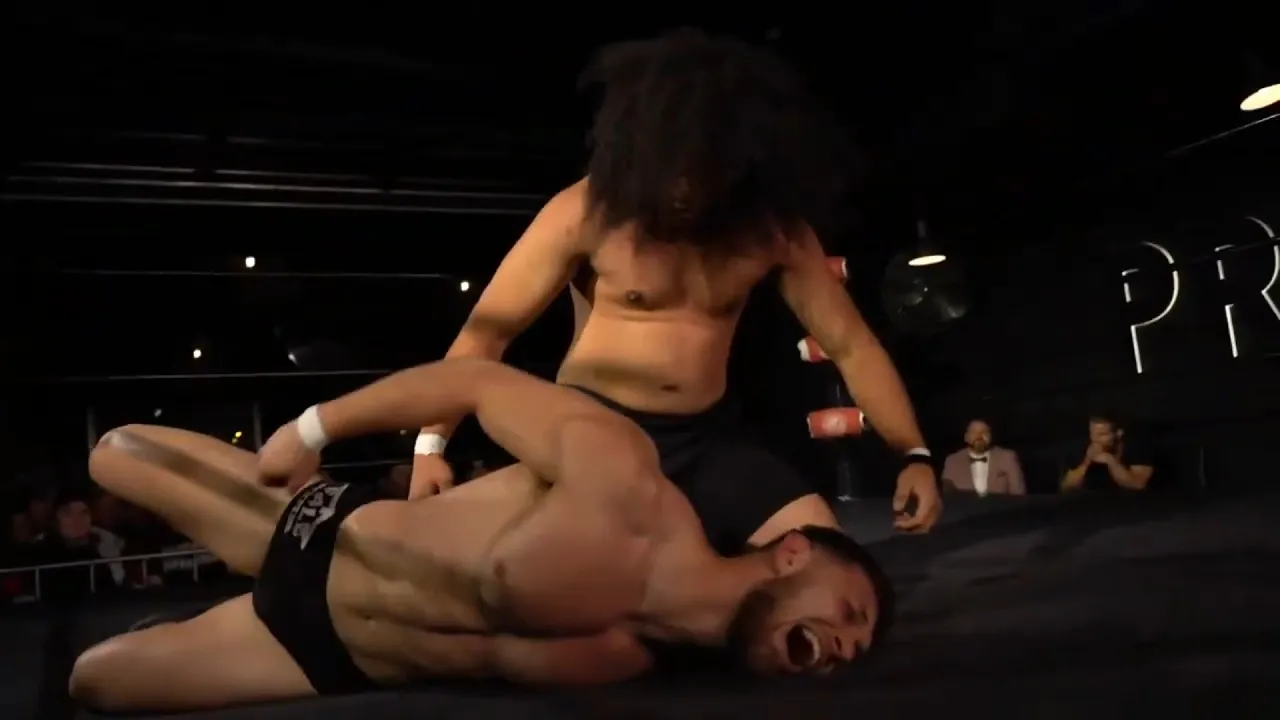 Male wrestlers squashed in the ring -Edition 59 background