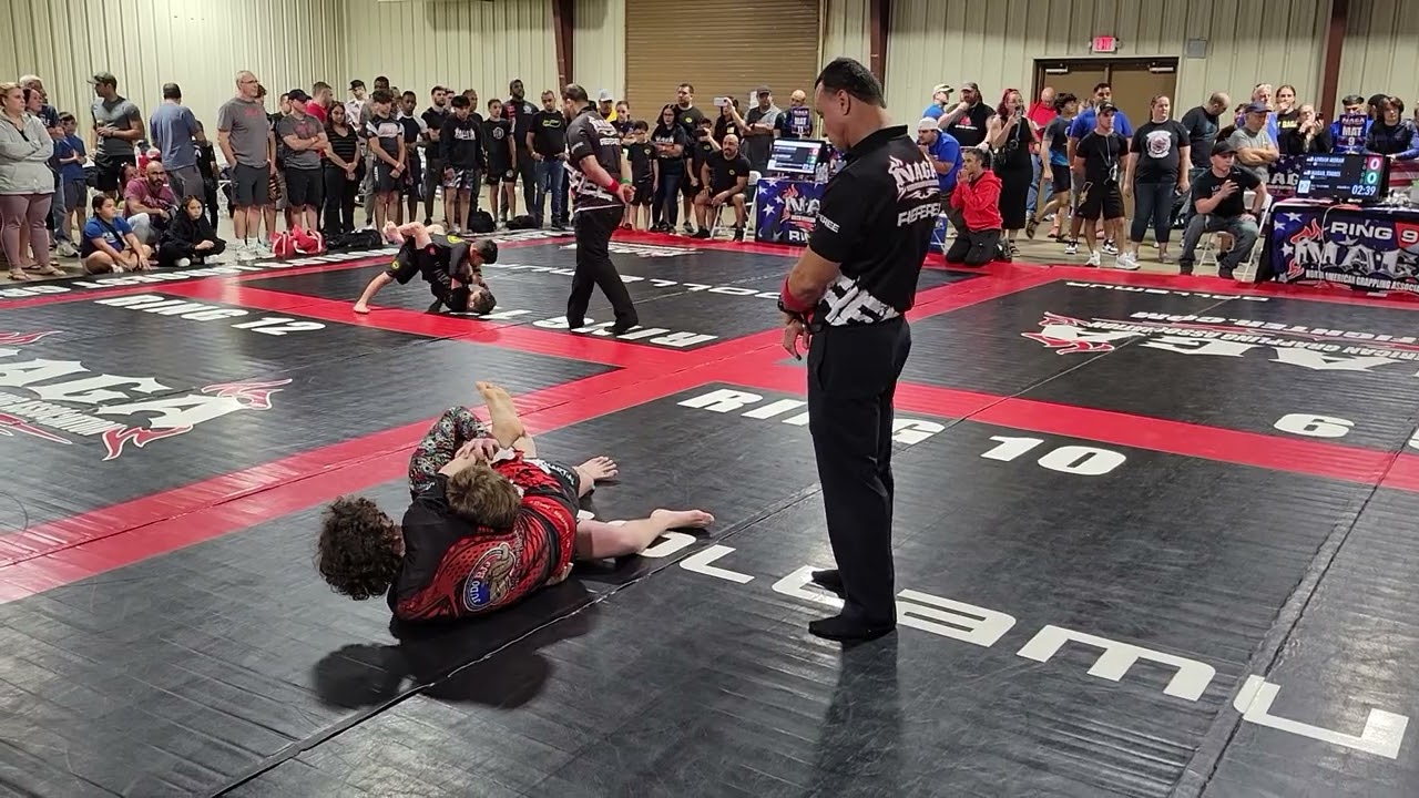 Competitor In BJJ No Gi Competition Gets Tunnel Vision Trying To Force A Submission. background