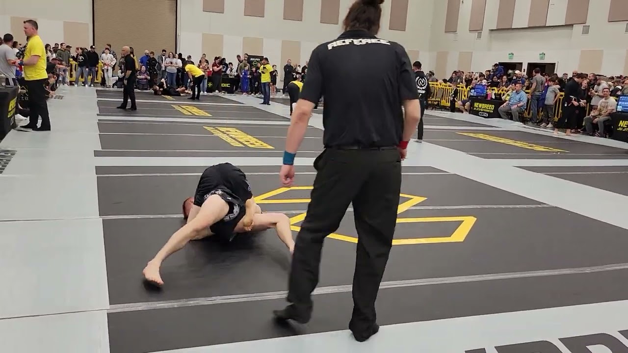 Brazilian Jiu-jitsu Competitors Fight Off Chokes In A Match