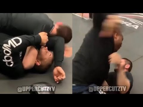 Khabib Tries To Submit DC, Gets Destroyed. background