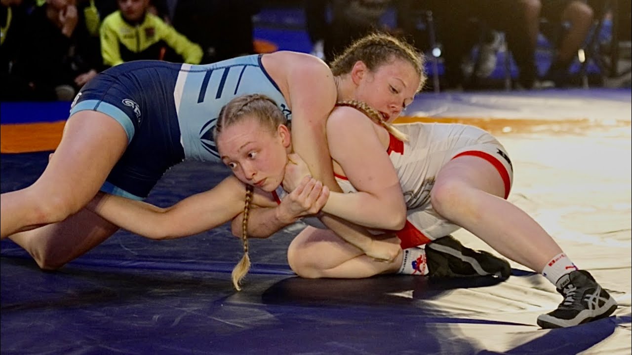 Friendly Europe vs USA. 50kg J. Ala-Ranta (FIN) vs C. Booe (USA). Women youth wrestling. background