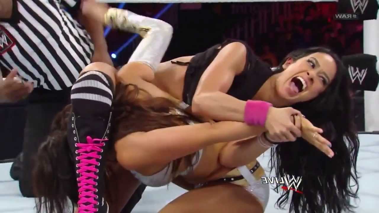 Layla Slaps and Grabs AJ Lee's Ass background