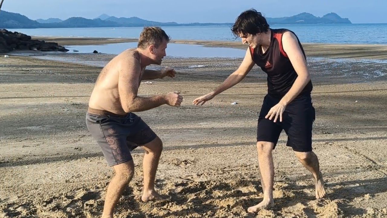 Teaching wrestling on the beach 