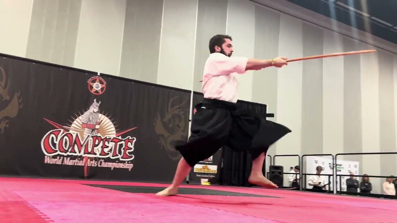 Michael Brumme Men's Non-Bladed Traditional Weapons - Compete Internationals 2025 backdrop