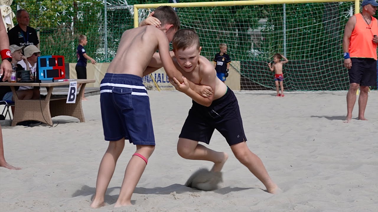 U13 Maksim Schevchenko (EST) vs Artur Kopli (EST) 35kg. Boys youth beach wrestling. background