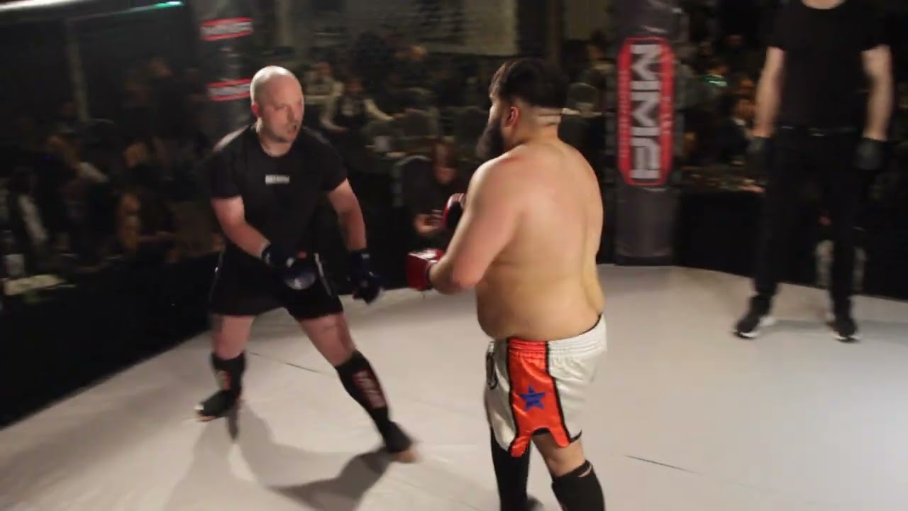 ULTRA MMA GLASGOW 190424 FIGHT 29 MUHAMMED UMAR IQBAL VS MICHAEL FISHER background