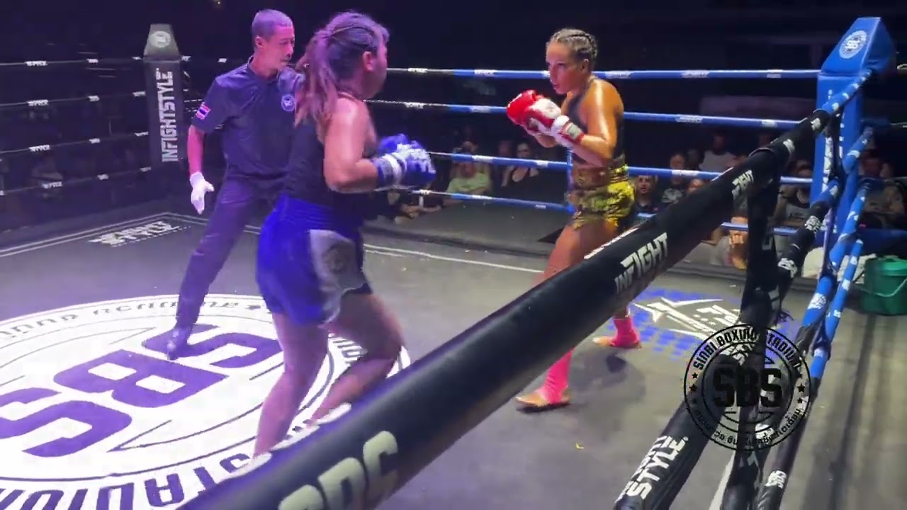 Fatin Sinbi Muay Thai 🇲🇦(red) defeats Petchmalatee S. Sakchay 🇹🇭 (blue) by TKO in round 2 background