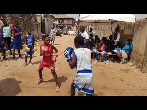 Nigerian Female boxers.. Tijani Haleeyah vs Ife Oluwa at boxing competition trial program background