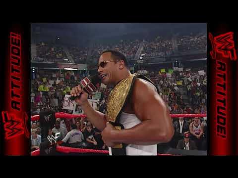 The Rock and mini Booker T | RAW IS WAR (2001) background