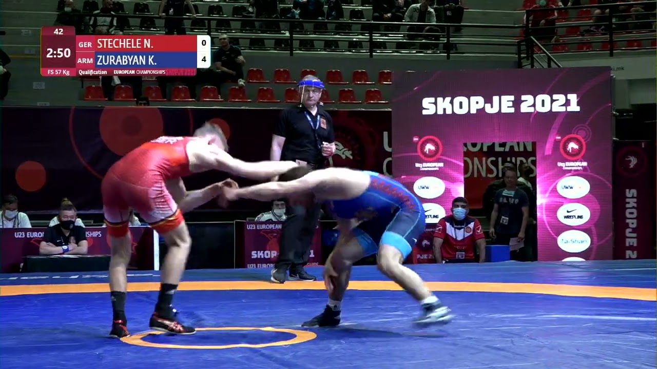 Qual. FS - 57 kg: N. STECHELE (GER) v. K. ZURABYAN (ARM) background