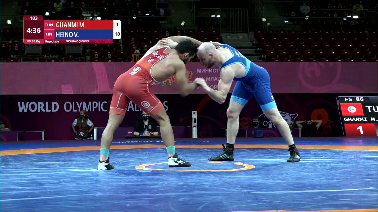 Repechage FS - 86 kg: M. GHANMI (TUN) v. V. HEINO (FIN) background