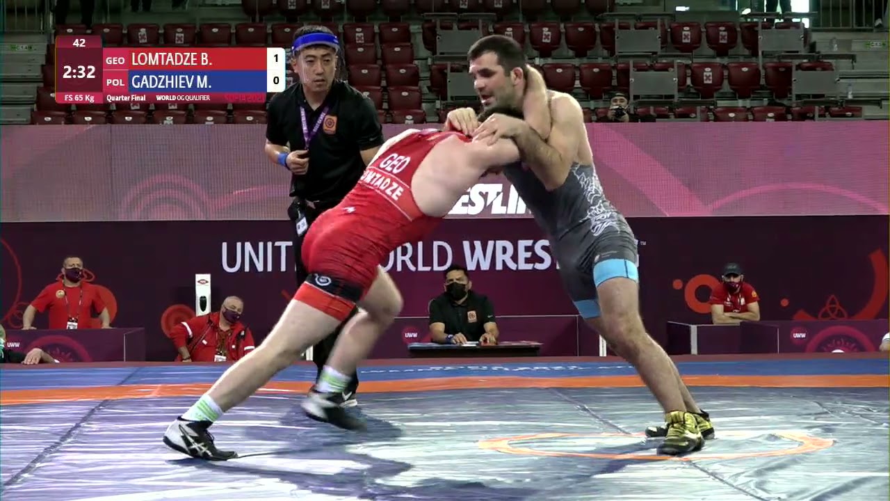 1/4 FS - 65 kg: B. LOMTADZE (GEO) v. M. GADZHIEV (POL) background
