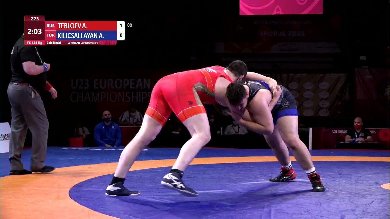 GOLD FS - 125 kg: A. TEBLOEV (RUS) v. A. KILICSALLAYA (TUR) background