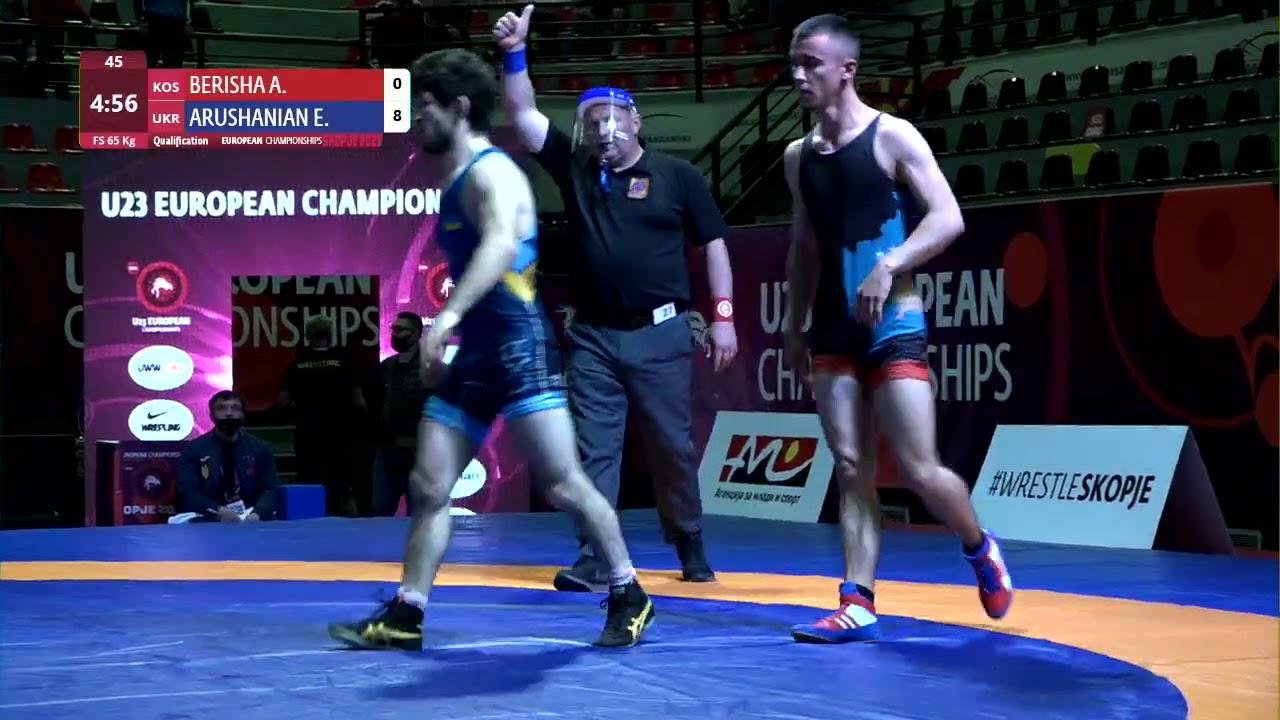 Qual. FS - 65 kg: A. BERISHA (KOS) v. E. ARUSHANIAN (UKR) background