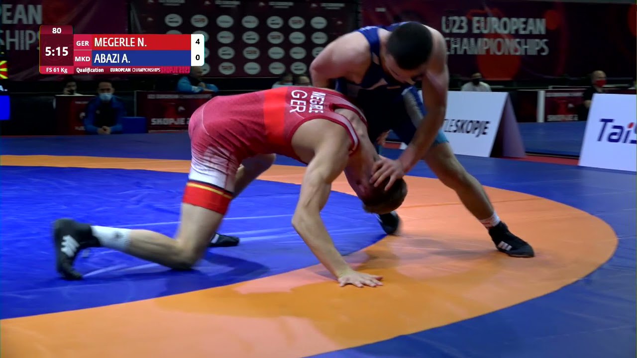 Qual. FS - 61 kg: N. MEGERLE (GER) v. A. ABAZI (MKD) background