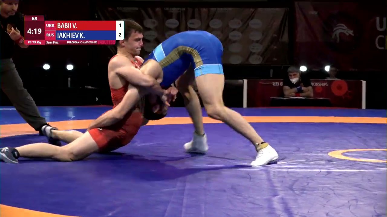 1/2 FS - 79 kg: V. BABII (UKR) v. K. IAKHIEV (RUS) background