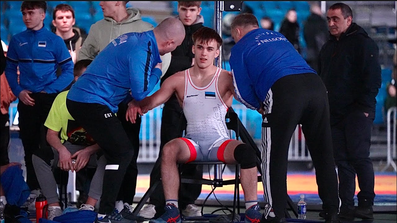 U20 Mardo Ärmus (EST) vs Bilal Mouskhabov (BEL) 71kg. Greco-roman men wrestling. background