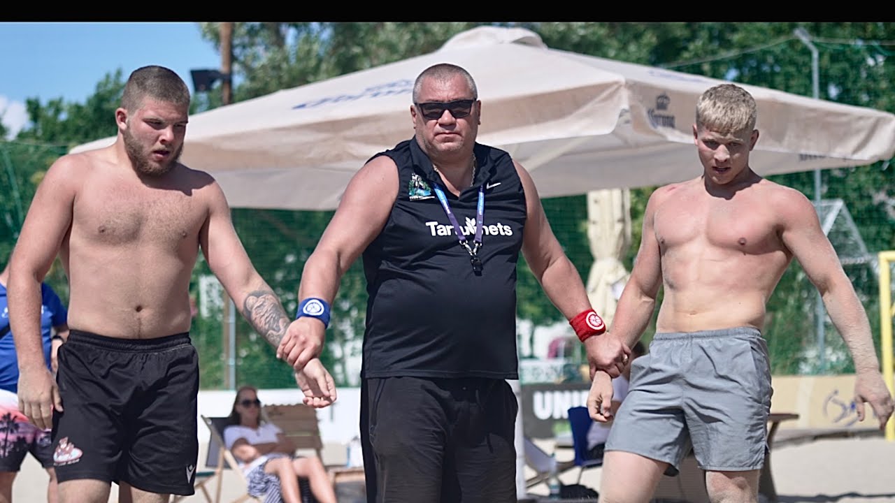 Raimond Uibo (EST) vs Andreas Välja (EST) 80kg. Men beach wrestling. background