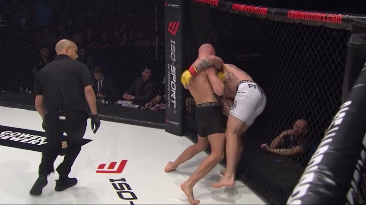 CW100: Brett Hassett vs Michael Corston background