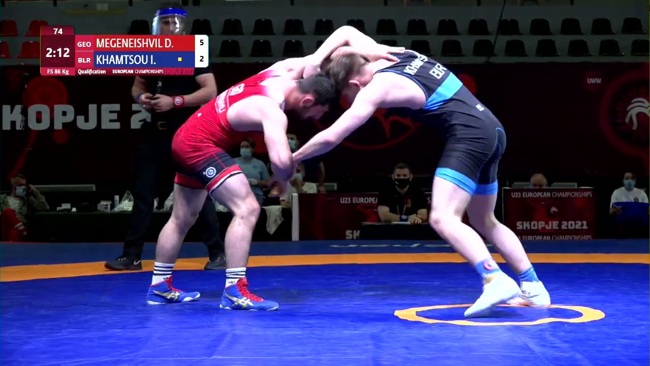 Qual. FS - 86 kg: D. MEGENEISHVIL (GEO) v. I. KHAMTSOU (BLR) background