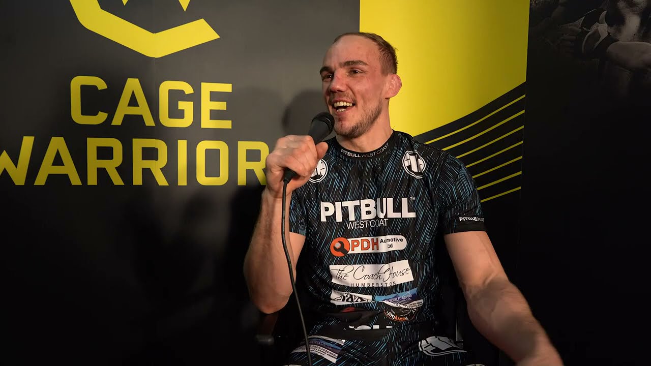 Edith Labelle speaks to Jack Grant after his win at CW 121 background