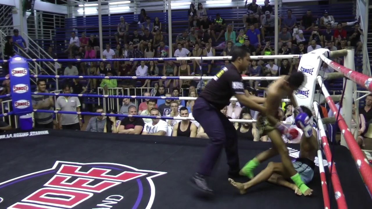Guy (Sinbi Muay Thai- Red Corner) fights at Bangla Stadium- 08.01.2017. background