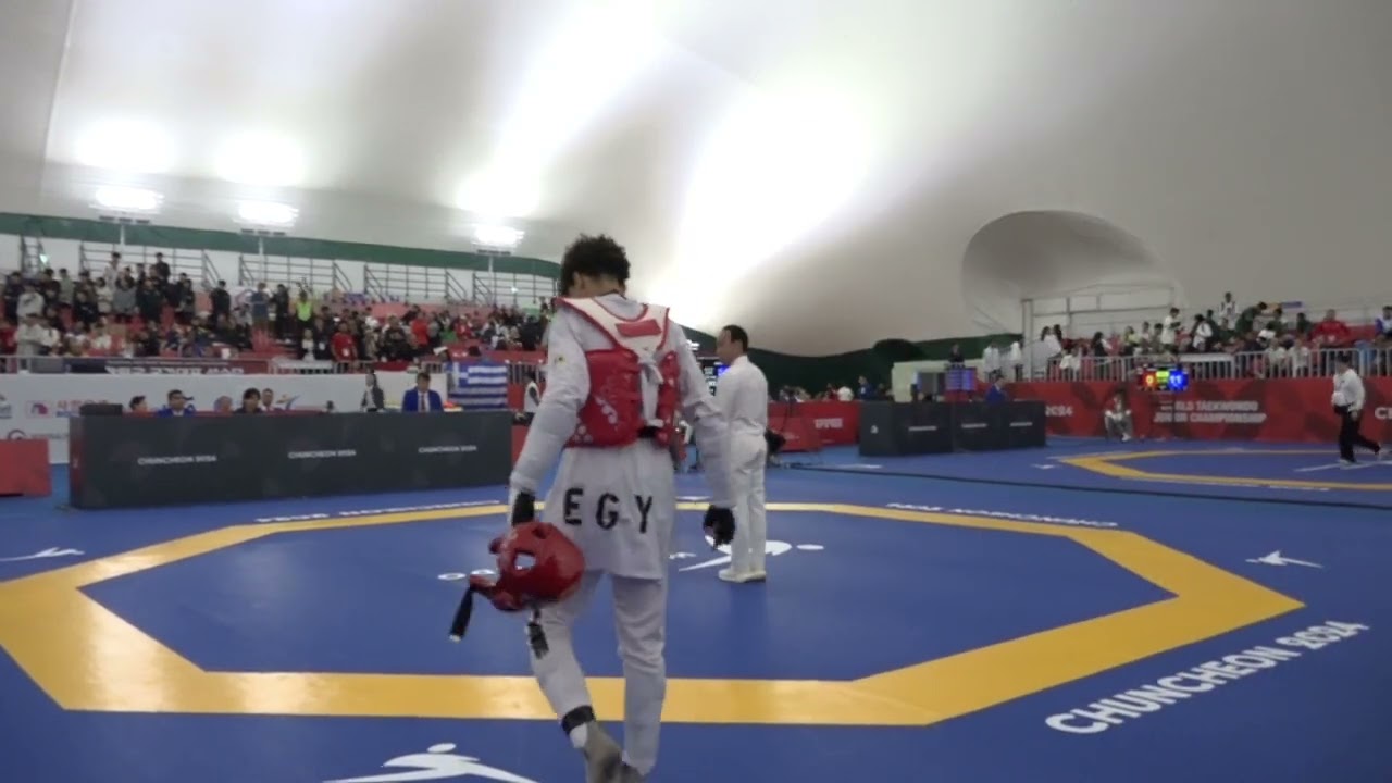 218 Round of 32 Men 51kg CYP T MENIKOU EGY A YAHYA MO background