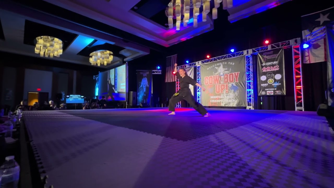 Lilli McGuire Women's CMX Forms Overall Grands - Cowboy Up Martial Arts Championships 2024 background