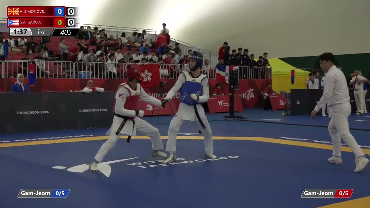 405 Round of 64 Men 63kg MKD H SIMONOVS PUR G A GARCIA background