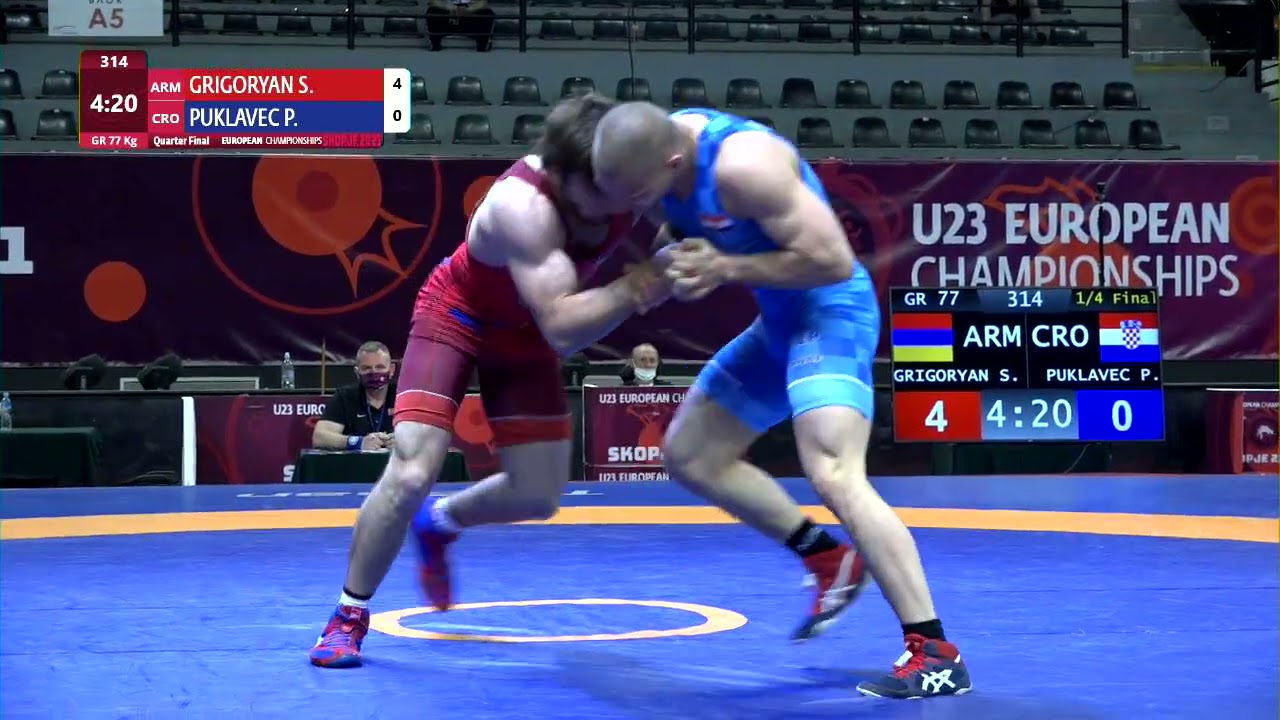 1/4 GR - 77 kg: S. GRIGORYAN (ARM) v. P. PUKLAVEC (CRO) background