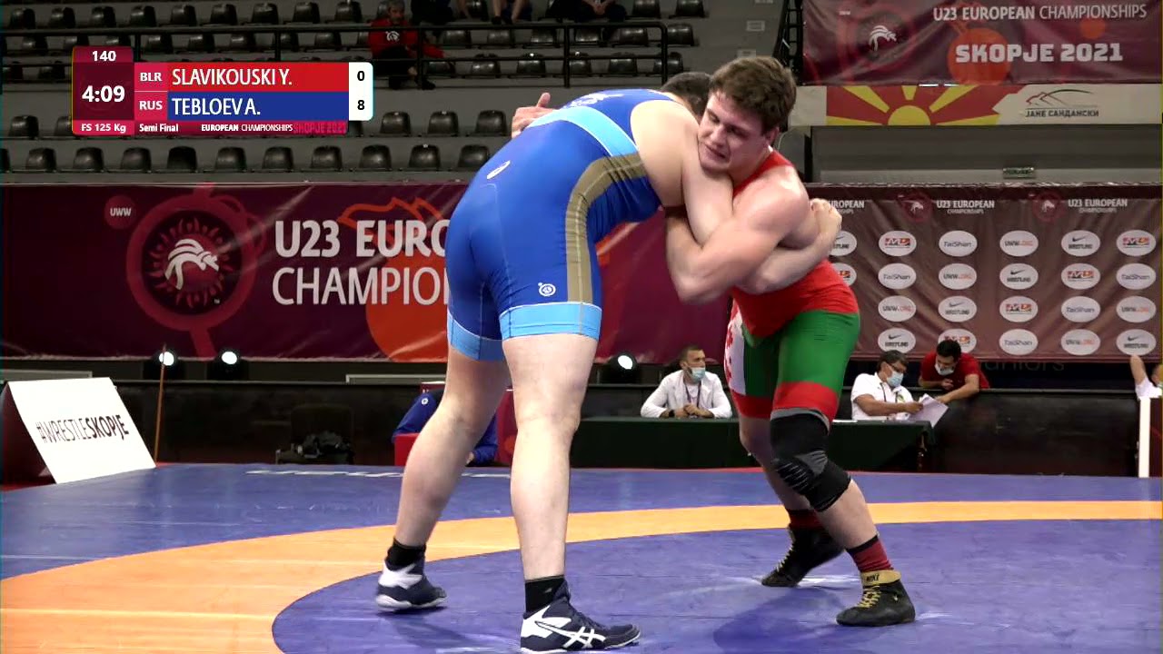 1/2 FS - 125 kg: Y. SLAVIKOUSKI (BLR) v. A. TEBLOEV (RUS) background