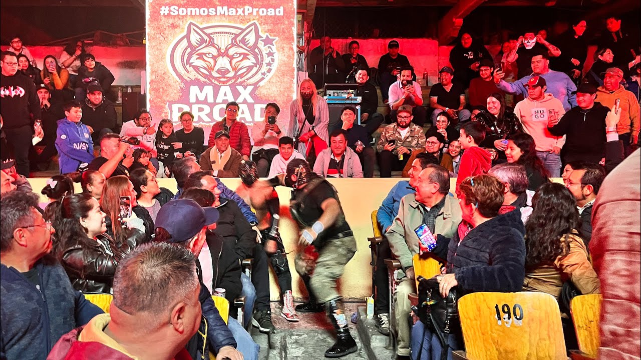 Máximo, Brazo Cibernético Jr y Mosquetero del Diablo Vs Carta Brava Jr, Mocho Cota Jr y background