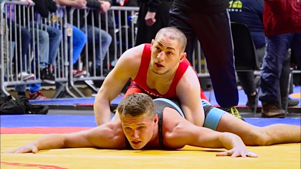 U17 A. Umkhadijev (FRA) vs S. Shadowshot (RSA). Freestyle 71kg youth wrestling. background