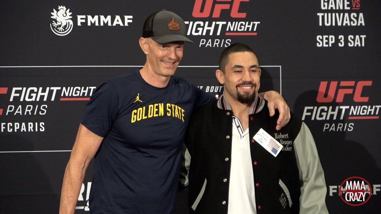 Robert Whittaker receives USADA jacket from Jeff Novitsky for 50 clean tests background
