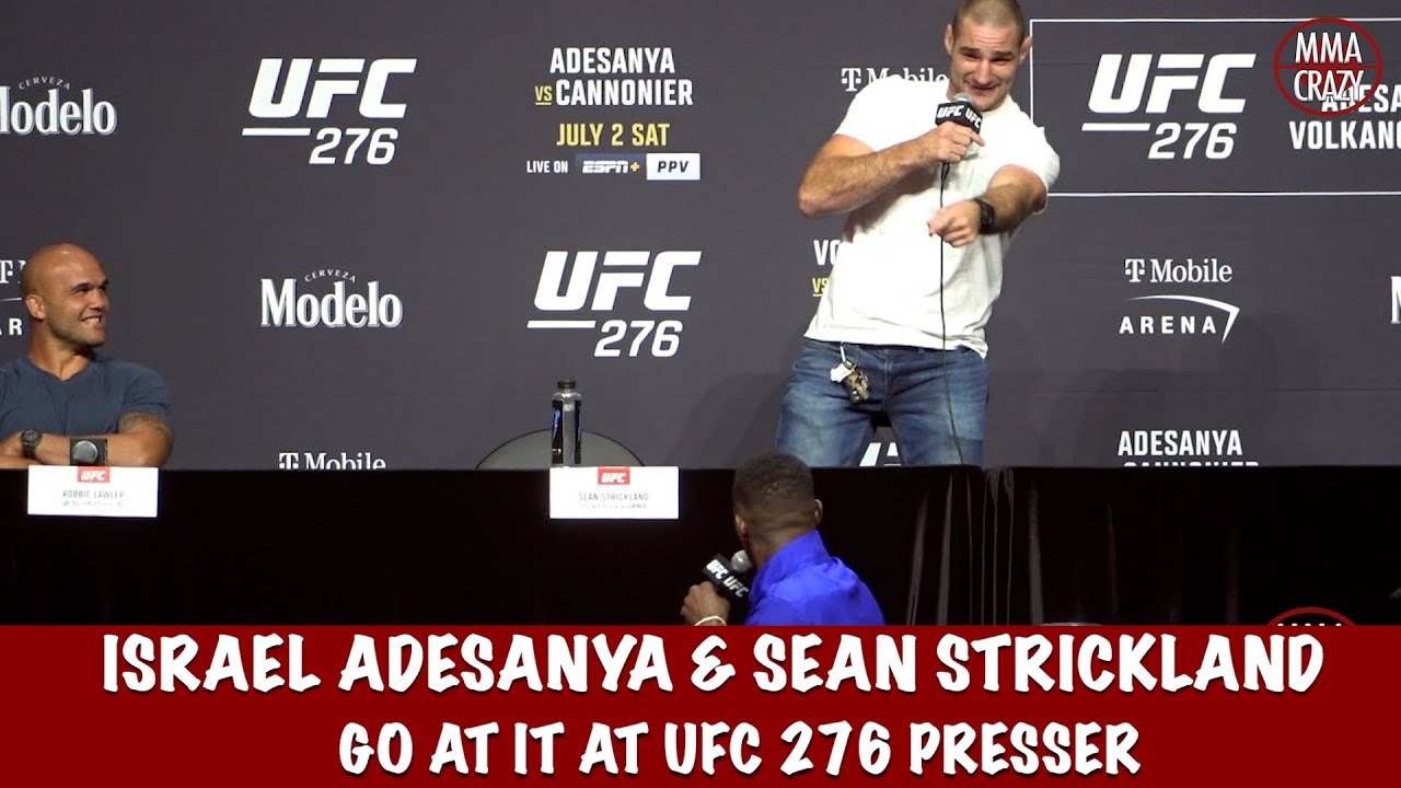 Israel Adesanya & Sean Strickland go at it at the UFC 276 Press conference background