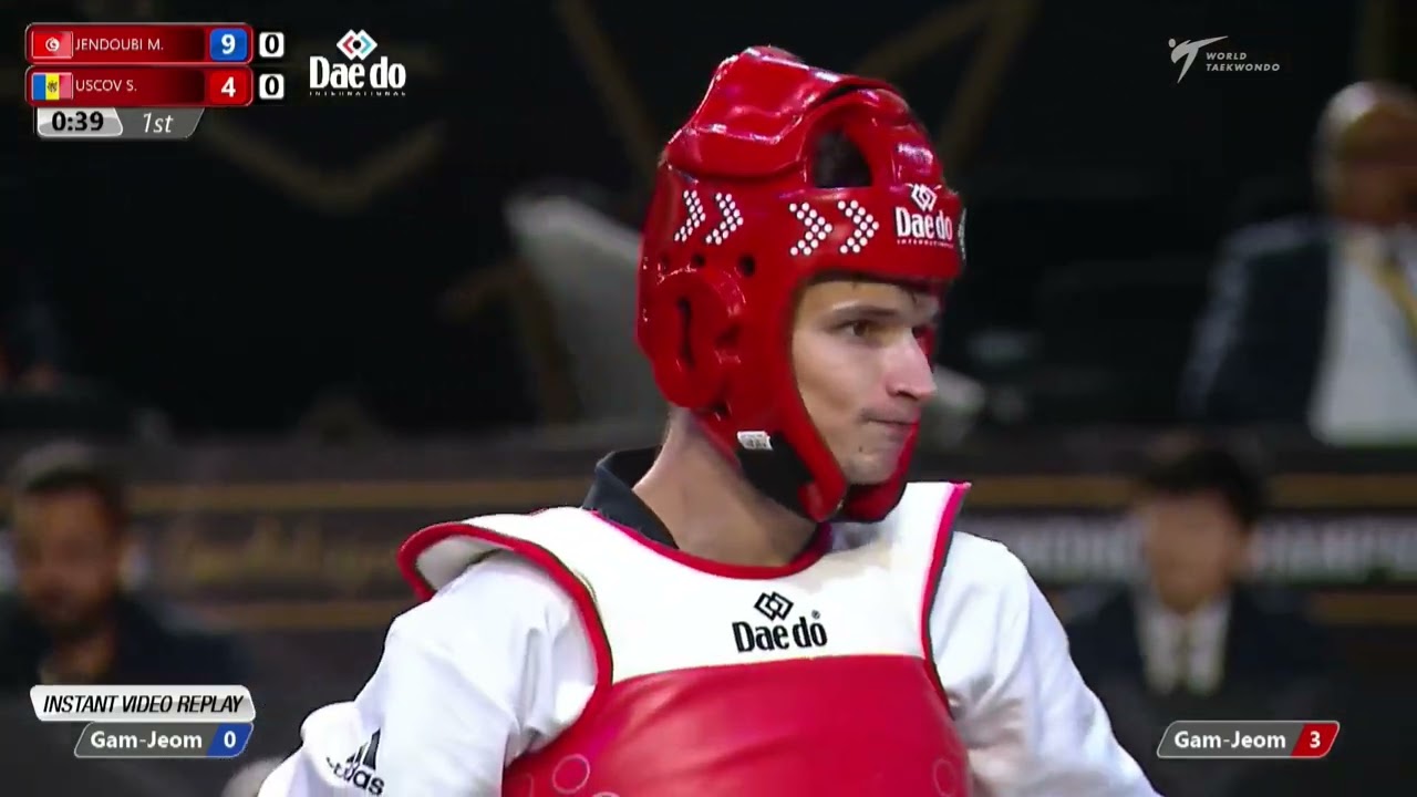 313 M-58kg R-32 JENDOUBI M. K. TUN 🔵 vs 🔴 USCOV S. MDA I Guadalajara 2022 WT Championships background
