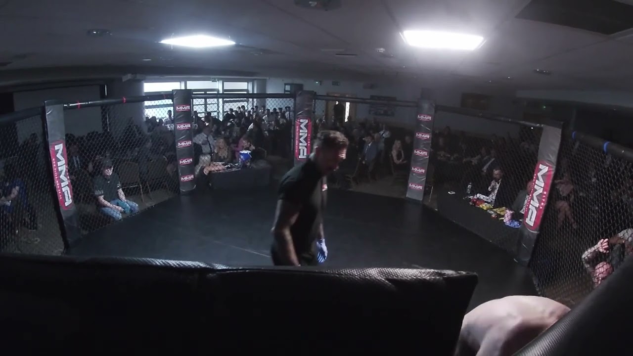 Ultra MMA | Hull | Ashley Dean V Corey the Bonesaw Wood background