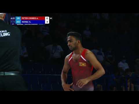 Qual. FS - 70 kg: A. PETER COOREG (SRI) v. S. NOVAC (MDA) background