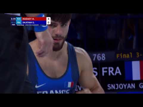 BRONZE GR - 67 kg: M. IMADAEV (RUS) v. G. SNJOYAN (FRA) background