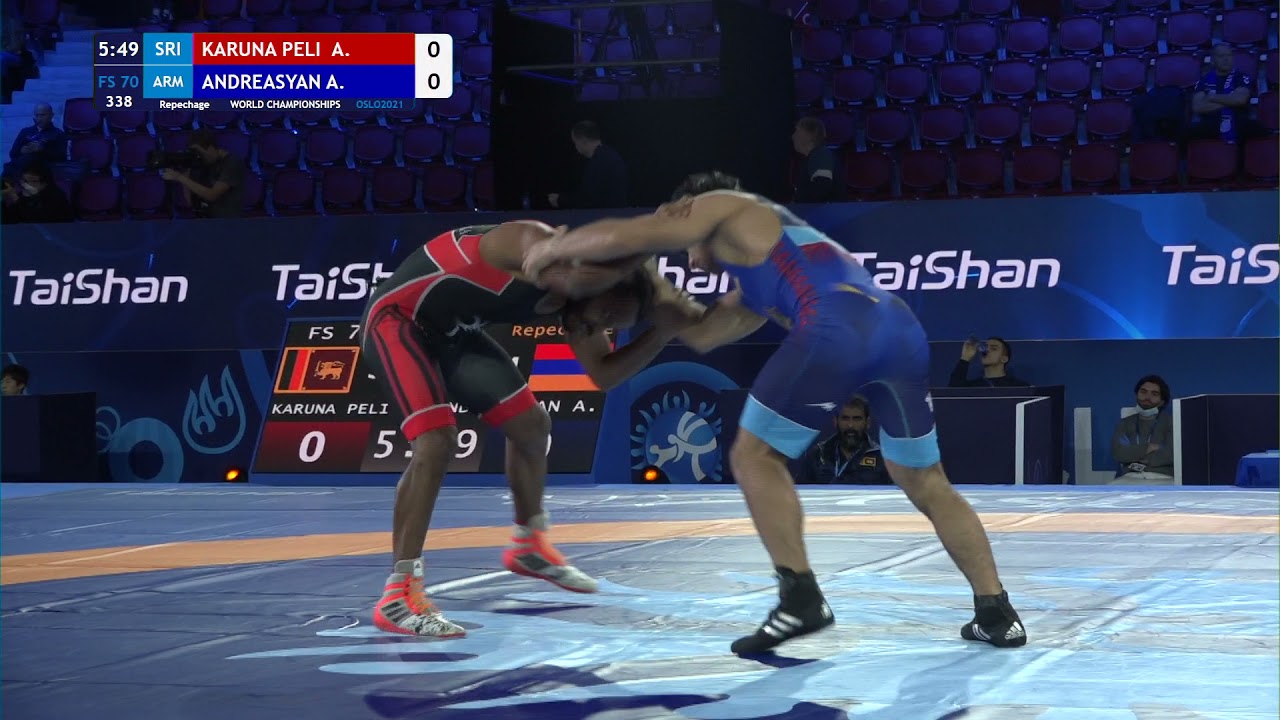 Repechage FS - 70 kg: A. KARUNA PELI (SRI) v. A. ANDREASYAN (ARM) background