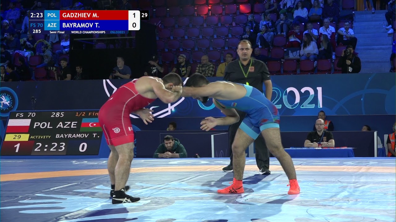 1/2 FS - 70 kg: M. GADZHIEV (POL) v. T. BAYRAMOV (AZE) background