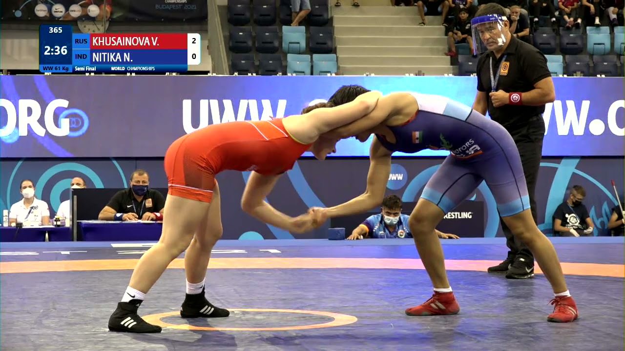 1/2 WW - 61 kg: V. KHUSAINOVA (RUS) v. N. NITIKA (IND) background