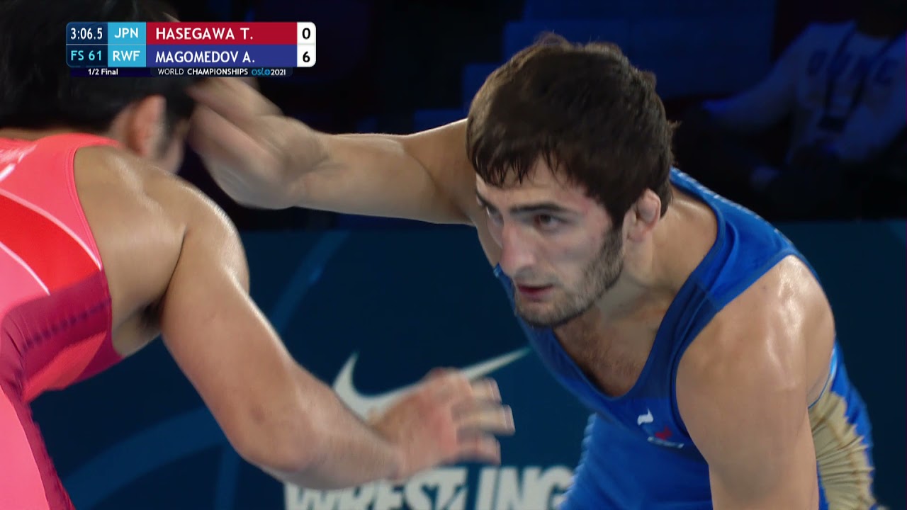 1/2 FS - 61 kg: T. HASEGAWA (JPN) v. A. MAGOMEDOV (RWF) background