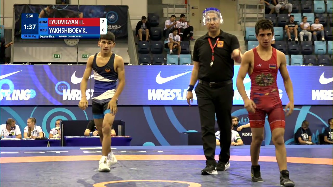 1/4 GR - 51 kg: H. LYUDVIGYAN (ARM) v. K. YAKHSHIBOEV (UZB) background