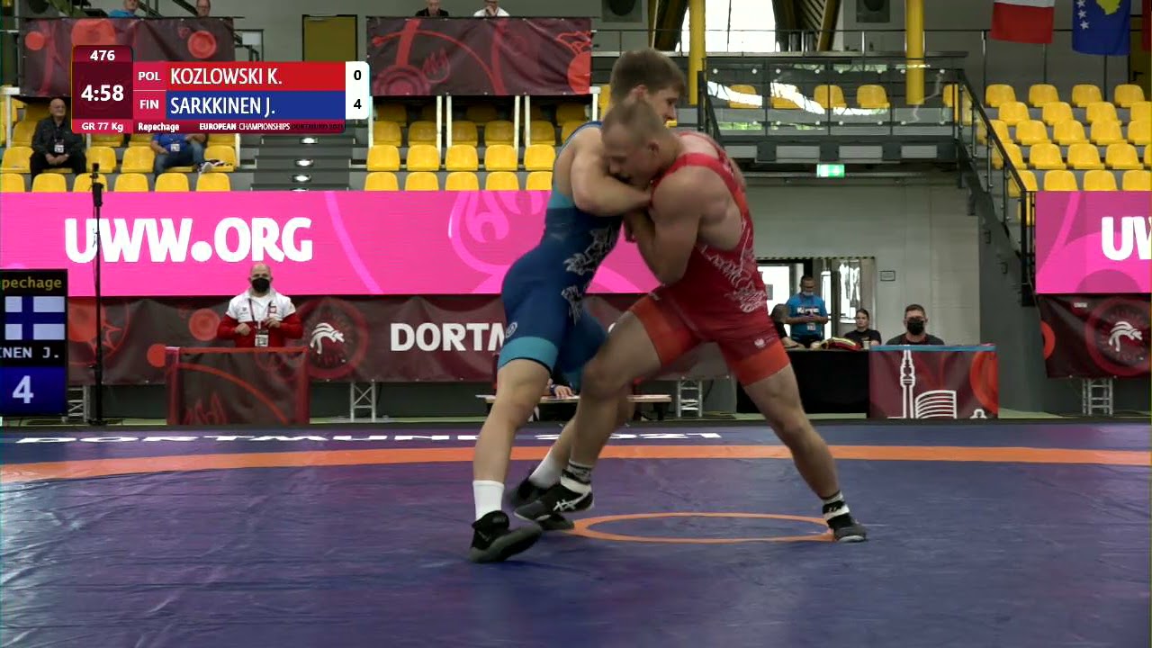 Repechage GR - 77 kg: K. KOZLOWSKI (POL) v. J. SARKKINEN (FIN) background