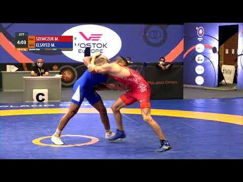 1/4 GR - 67 kg: M. SZEWCZUK (POL) v. M. ELSAYED (EGY) background