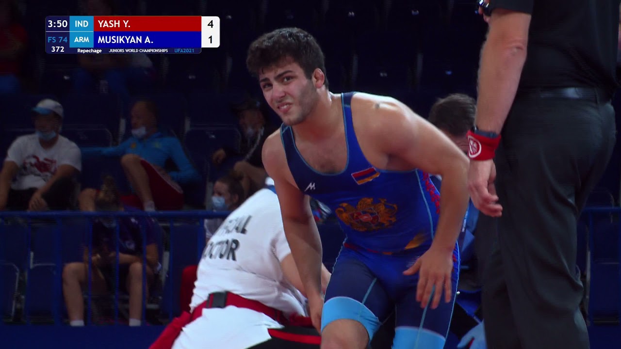 Repechage FS - 74 kg: Y. YASH (IND) v. A. MUSIKYAN (ARM) background